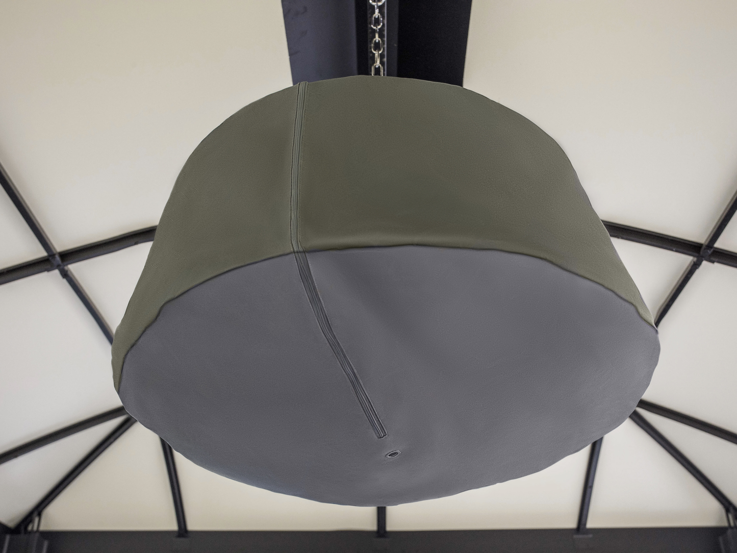 Glow pendent hanging from gazebo with gray cover