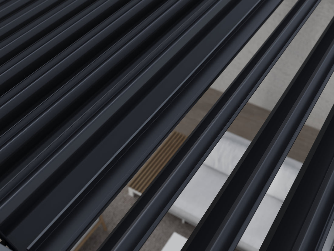 Close-up of black louvers on the roof of a louvered pergola.